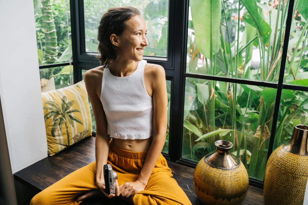 woman by window in Hawaii on Ag land in Kailua Kona