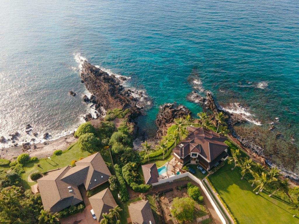 luxury hawaii oceanfront home aerial with a pool